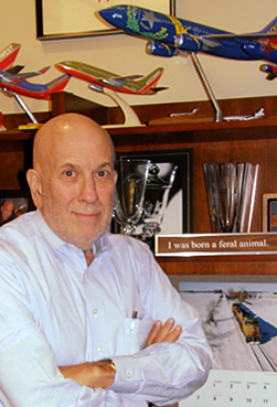 Mike Levy's fascination with airplanes is evident in his office. He once took 9 Gs during a ride on an F-16 fighter jet and passed out.