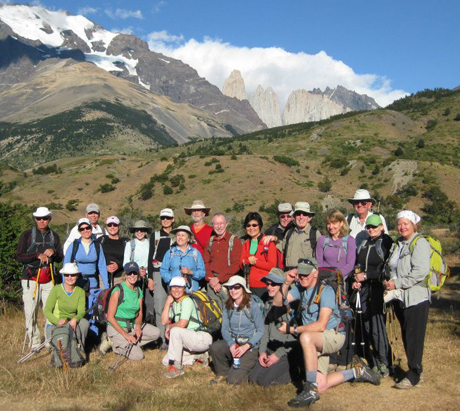 Richardson traveled with a large hiking group in 2012 to the Patagonia region in South America. She's standing, with a broad brim safari hat with a white shirt.