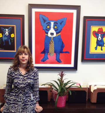 Robin Fredrickson’s office at Latham & Watkins in Houston features “Blue Dog” lithographs by artist George Rodrigue.