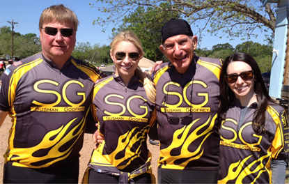 Steve Susman (second from left) with his bicycle riding partner and former client Terry Casey and his two stepdaughters, Amanda and Whitney Fox