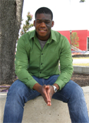 James Nortey poses in the Mueller development. Behind him, "The Thinkery," being built by Austin Children's Museum, is slated for a December opening.