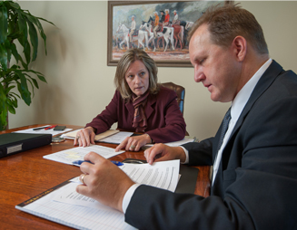 Shauna Wright (Kelly Hart) and Don Reid (Hillwood Properties), prepare for a family law trial for a pro bono client. Kelly Hart hosted an in-house CLE for lawyers who were interested in taking a case. Photo courtesy of Glen Ellman.
