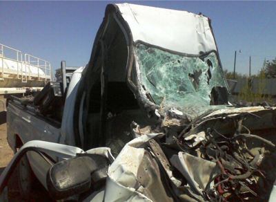 The remnants of a crew truck that collided head-first into an oil rig trailer on Sept. 20, 2012 on RR-2119 due to the 18-wheeler's negligent driving.