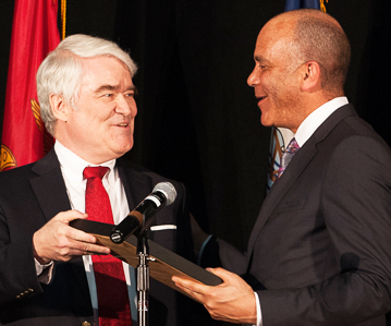 Justice Nathan Hecht presenting award to retired Justice Wallace Jefferson