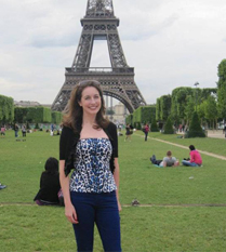 Like many Americans in Paris, Stephanie Gause poses near the Eiffel Tower.