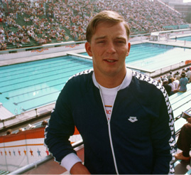Brian Farlow poses near Olympic swimming pool for 1984 Olympic Games.